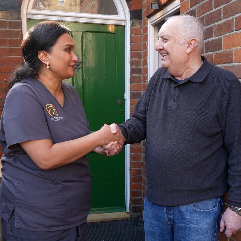 A patient shaking hands with his Providence Dental dentist
