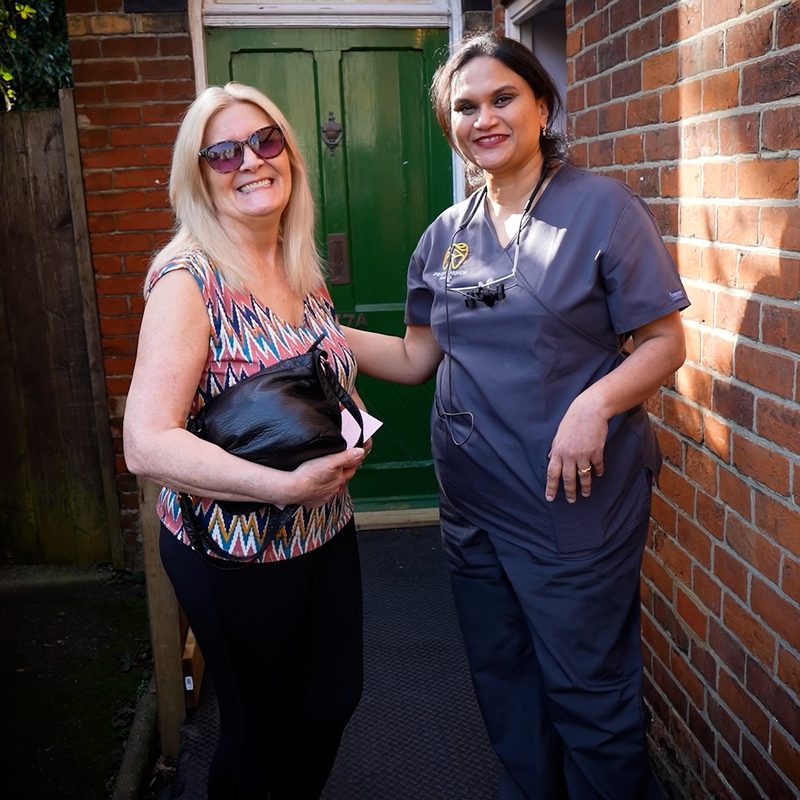 A smiling patient with her Providence Dental dentist